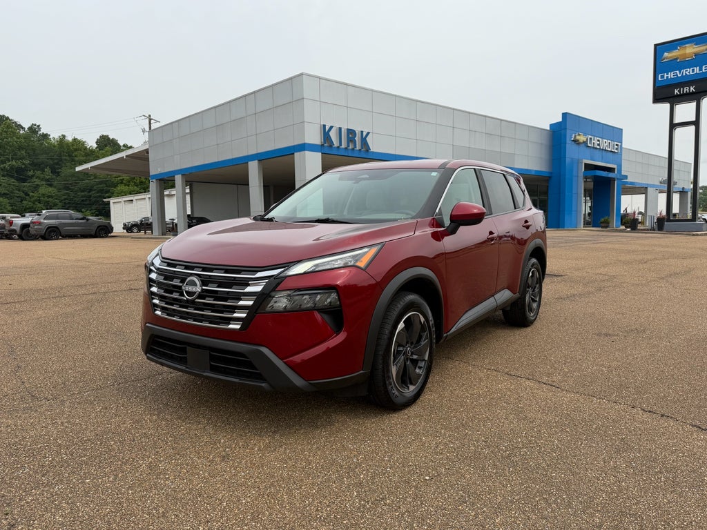 2025 Nissan Rogue SV in Red — front three-quarter view